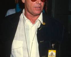 American actor Jack Nicholson, a pair of binoculars around his neck, attends a premiere of 'Batman' at the Mann Bruin Theater, Westwood, California, June 19, 1989. (Photo by Ron Galella, Ltd./Ron Galella Collection via Getty Images)