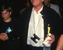 American actor Jack Nicholson, a pair of binoculars around his neck, attends a premiere of 'Batman' at the Mann Bruin Theater, Westwood, California, June 19, 1989. (Photo by Ron Galella, Ltd./Ron Galella Collection via Getty Images)