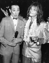 Comic actor Pee-Wee Herman (left) and singer David Lee Roth joking around together at the premiere of the movie