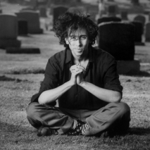 Director/producer Tim Burton sitting in a graveyard.  (Photo by Alan Levenson//Time Life Pictures/Getty Images)