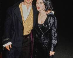 Actress Winona Ryder and actor Johnny Depp attend the "Edward Scissorhands" Westwood Premiere at Avco Center Cinemas in Westwood, California, US, 6th December 1990. (Photo by Vinnie Zuffante/Getty Images)